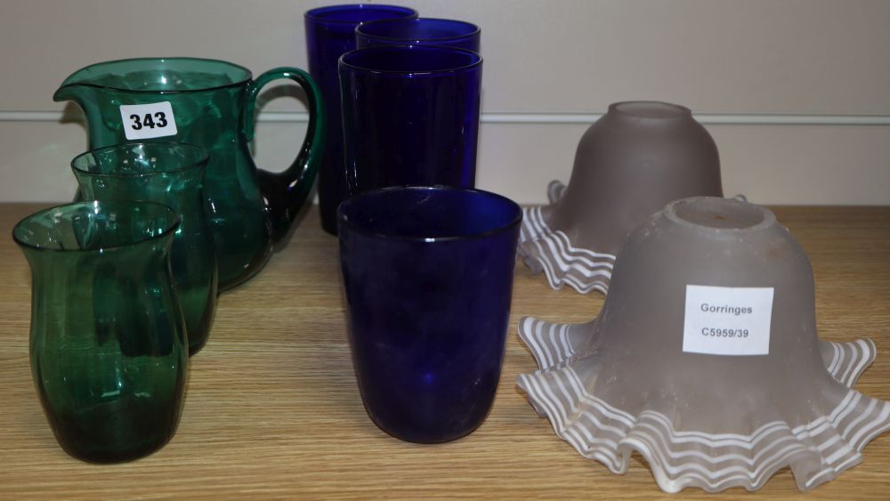 Three Bristol Blue glasses, green glass jug and two glasses and a pair of frilled edge glass shades